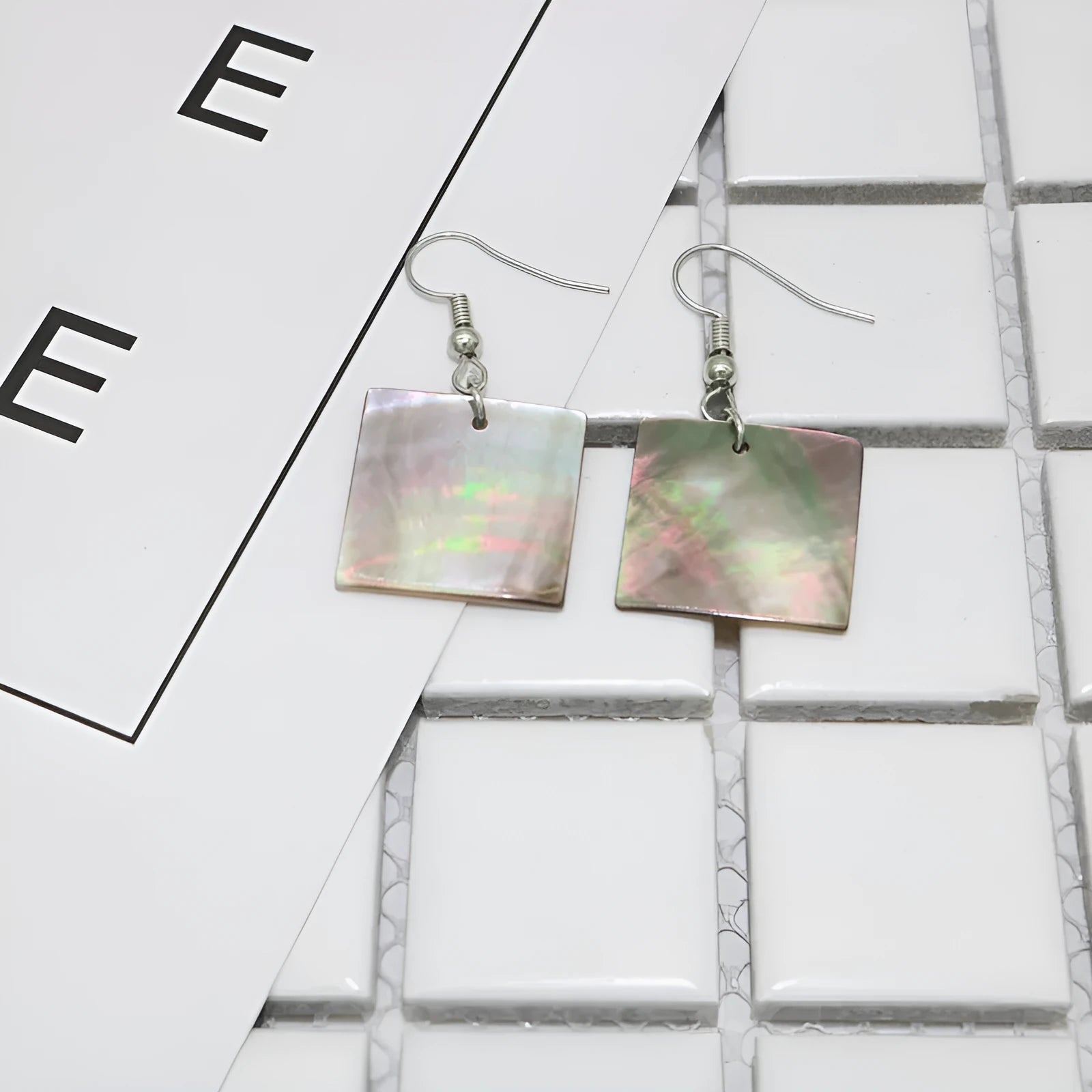 Women's geometric shell earrings in Square Panther and Rectangular Shell colours with retro natural styling