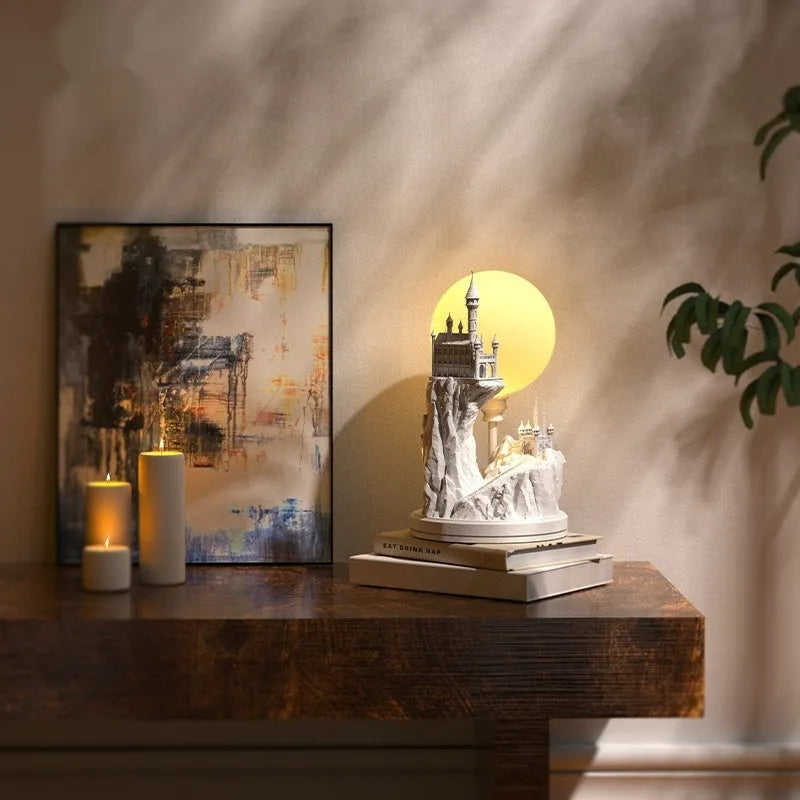 White composite gypsum table lamp with plug and wire switch on a table.