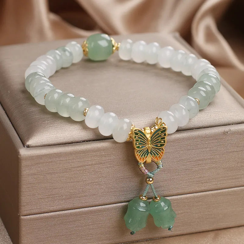 Green crystal abacus bead bracelet with butterfly tassel and pearl rhinestone decoration