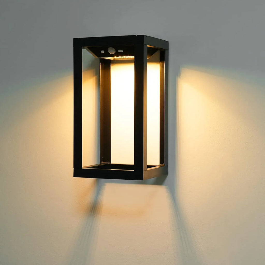 Modern Chinese-style outdoor solar wall lamp with plastic shell, shown in a garden setting.