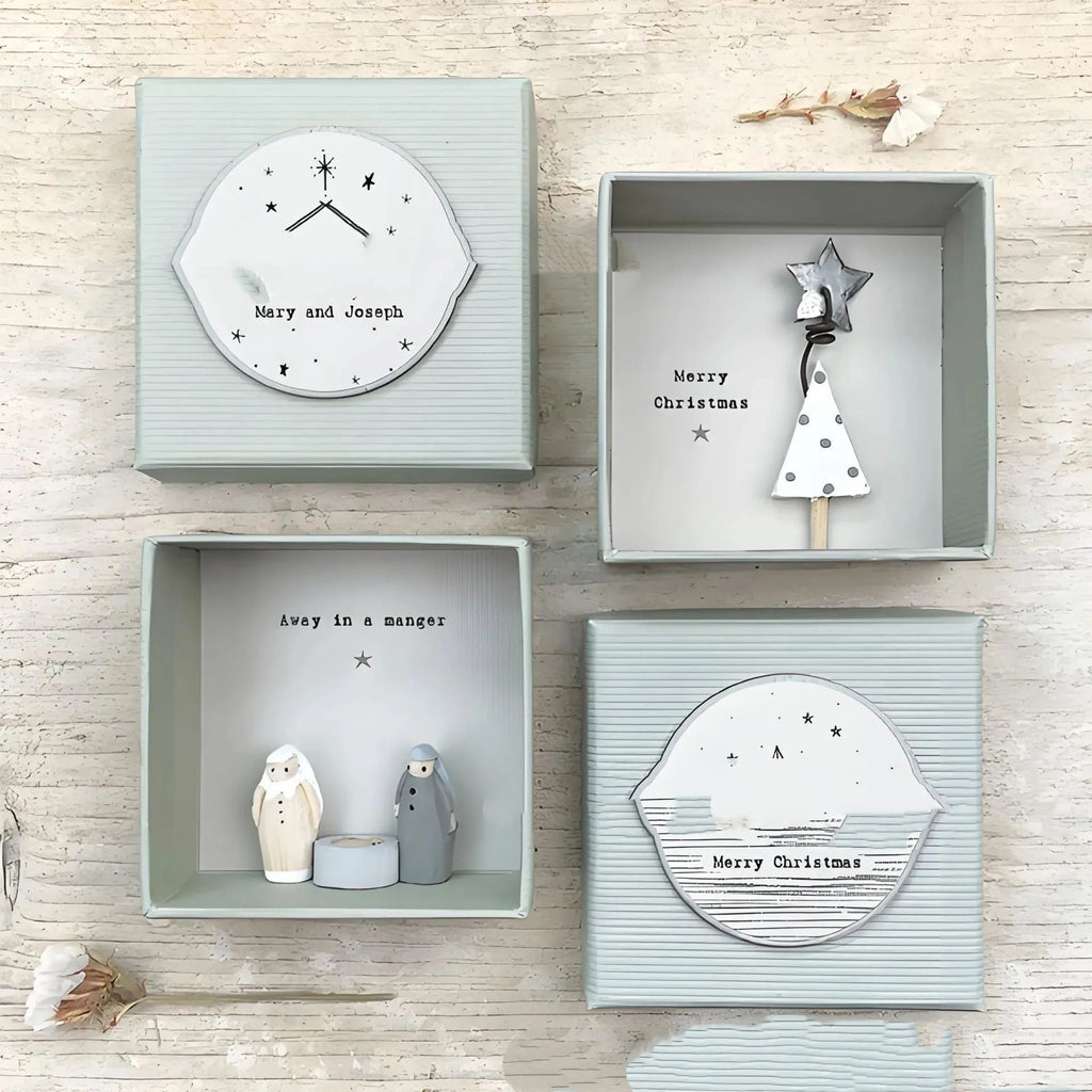 Boxed plastic and resin Guardian Angel ornament in a modern cartoon style, a gift for friends or children.