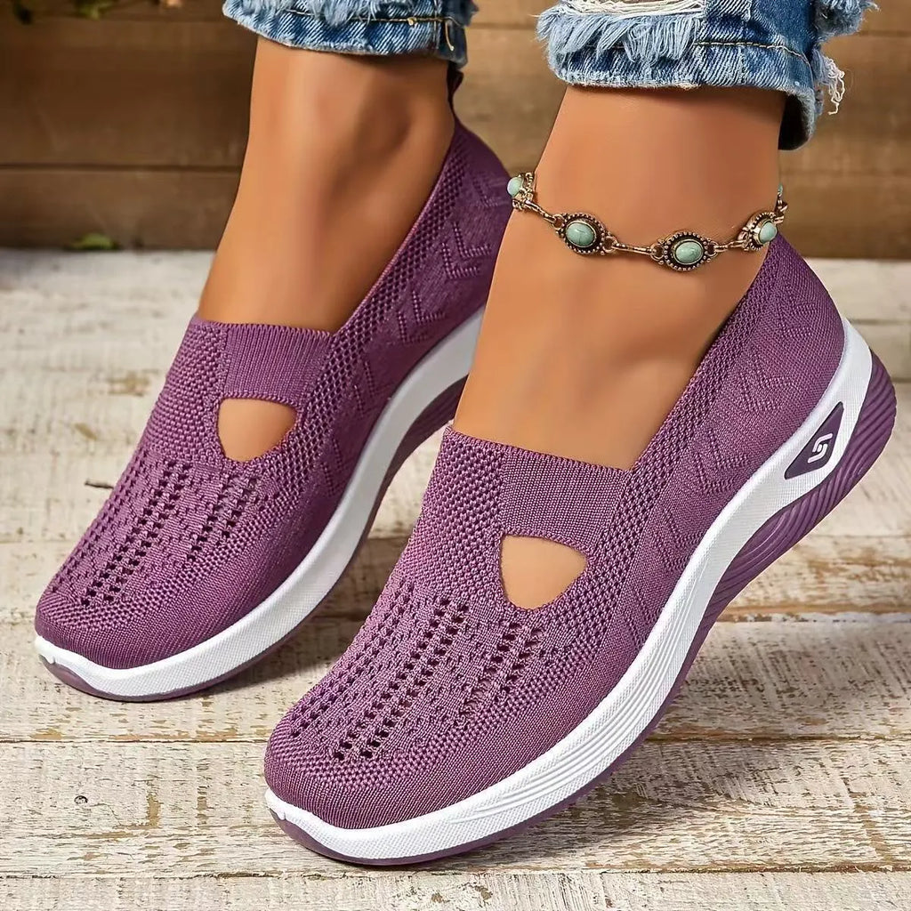 Pair of low top casual mesh shoes with T-strap and soft PVC sole in solid colour for elderly women