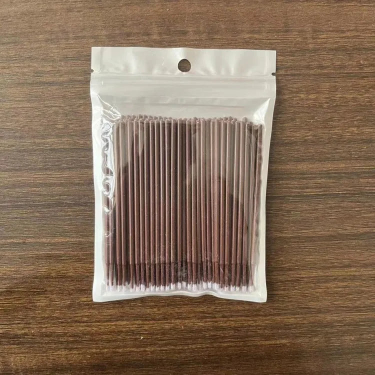 Disposable micro applicator brushes with bendable cotton tips and colour-coded handles for eyelash extensions