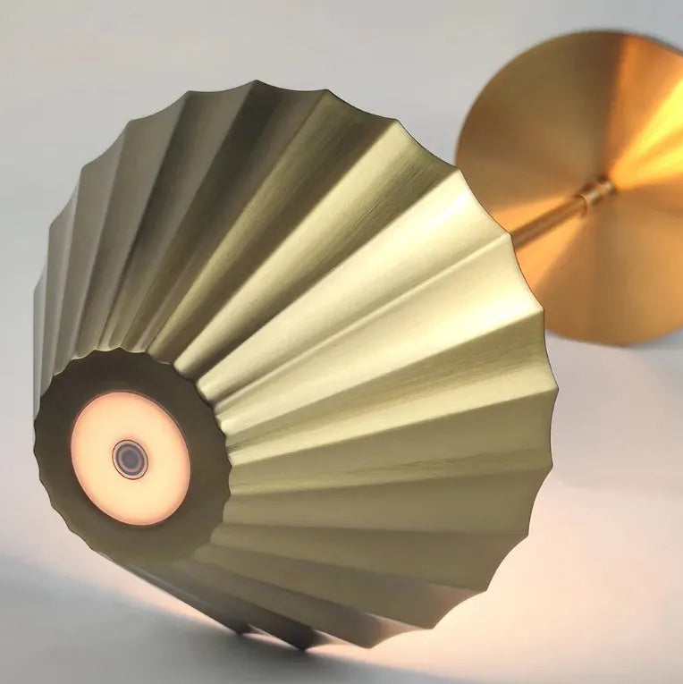 Gold-coloured alloy desk lamp with USB charging port and touch-sensitive control.