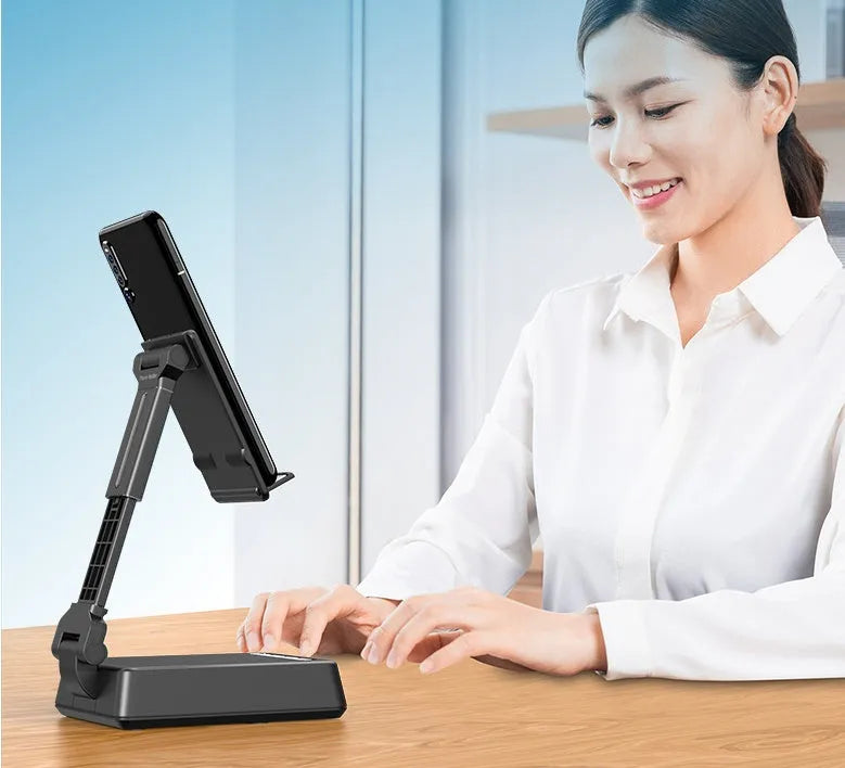 Black mobile phone stand with integrated Bluetooth speaker and microphone on a desk