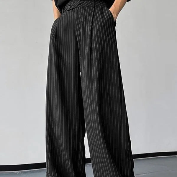 Men's black vertical striped pleated casual trousers with elastic waistband showing front detail