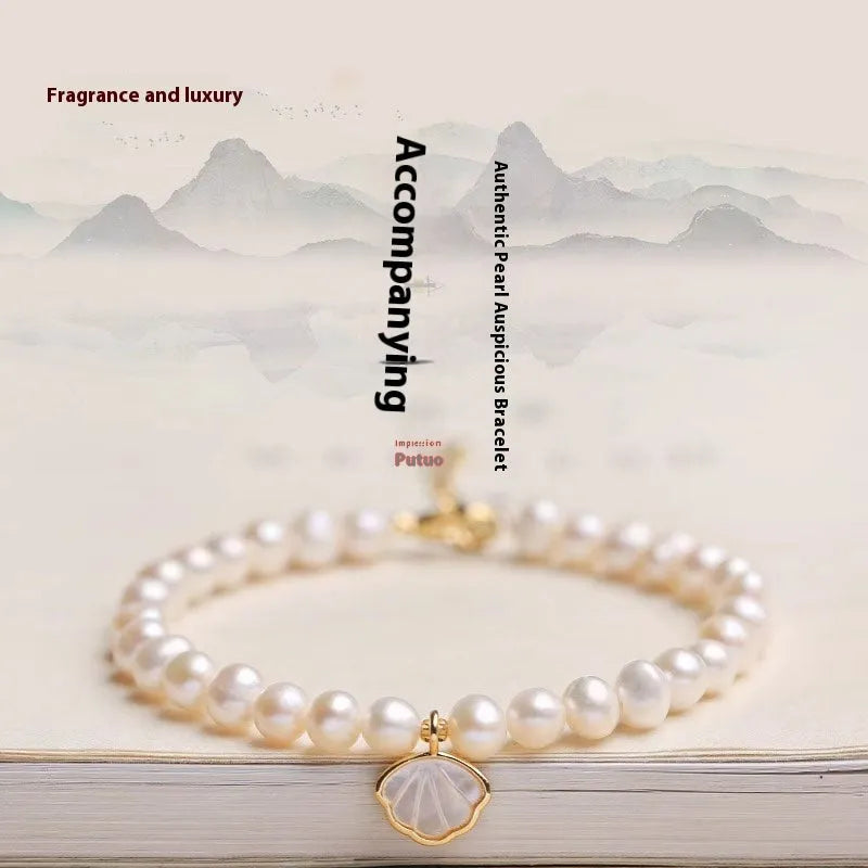 Women's freshwater pearl bracelet with fan-shaped design and elastic or chain fastening options