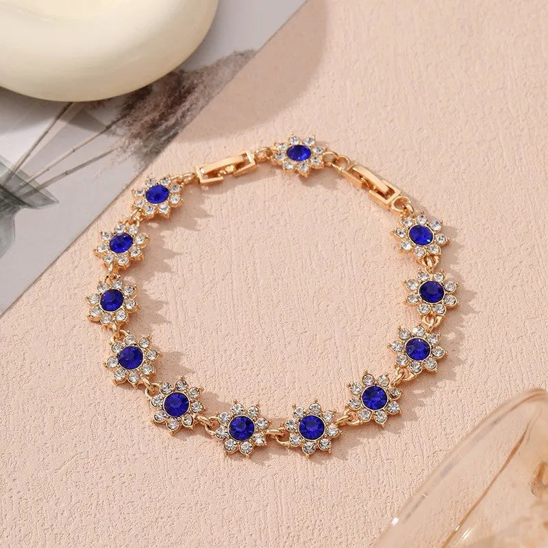 Flower charm bracelet in zinc alloy with electroplated finish and colourful crystal accents