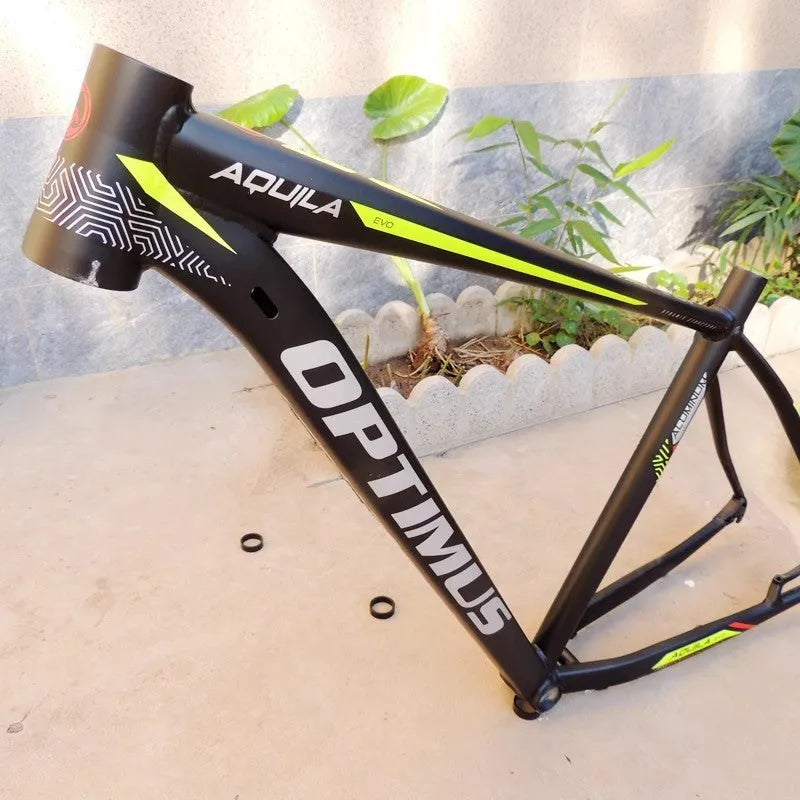 Black green aluminium mountain bike frame showing disc brake mount and internal cable routing ports