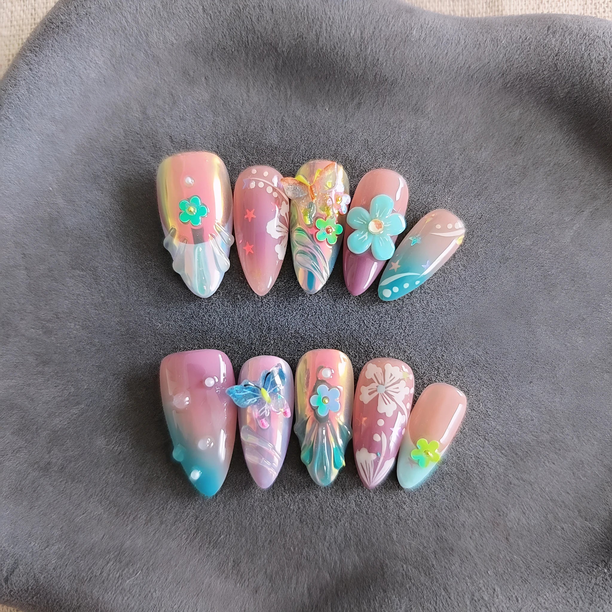 Handmade colourful 3D nail art sculptures of flowers and butterflies in four sizes XS S M L.