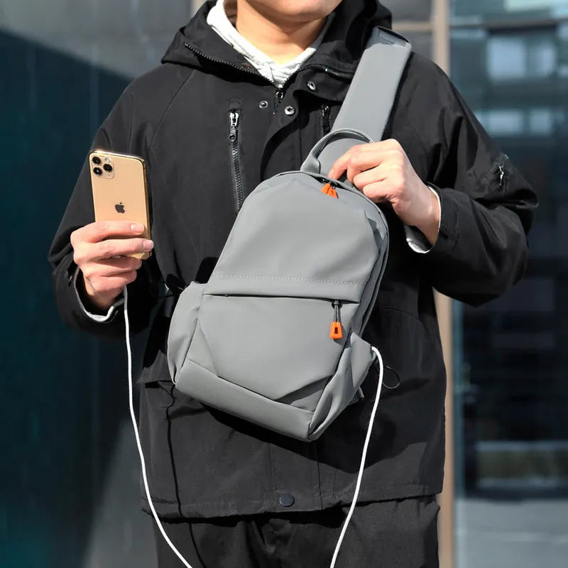 Men's black casual crossbody bag with a single shoulder strap made from waterproof polyester.