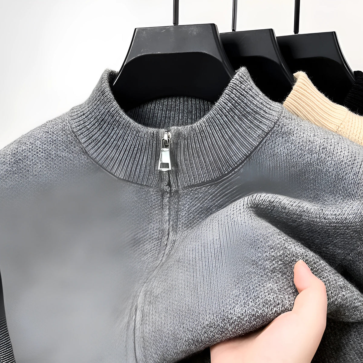 Man wearing a beige stand collar zip-front knitted cardigan with a loose fit.