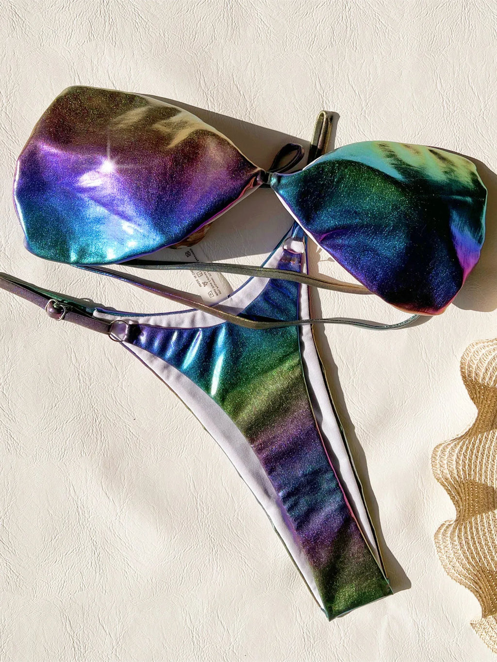 Women's purple gradient two-piece bikini swimsuit made from polyester fabric.