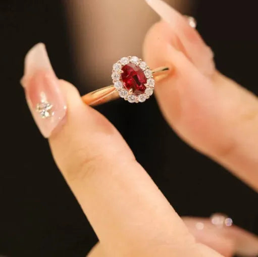 Women's sterling silver ring with gold pigeon design and red gemstone inlay on floral patterned band