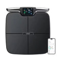 Black eight-electrode smart body composition scale on a floor