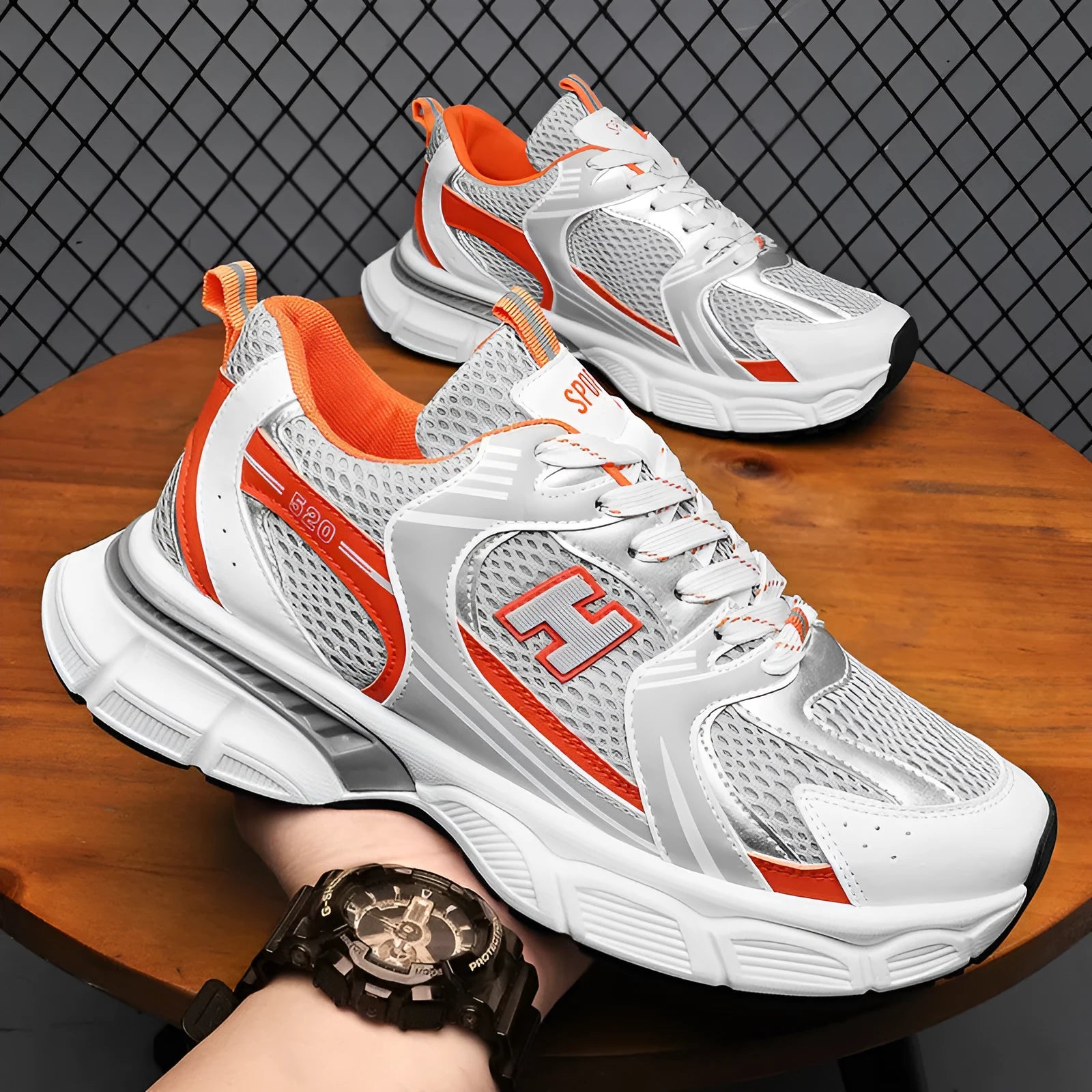 Men's mesh running shoes in black, white and gray, or white orange colours with plastic sole