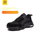 Black mesh breathable labour insurance safety shoes with anti-smash toe cap on a grey background.