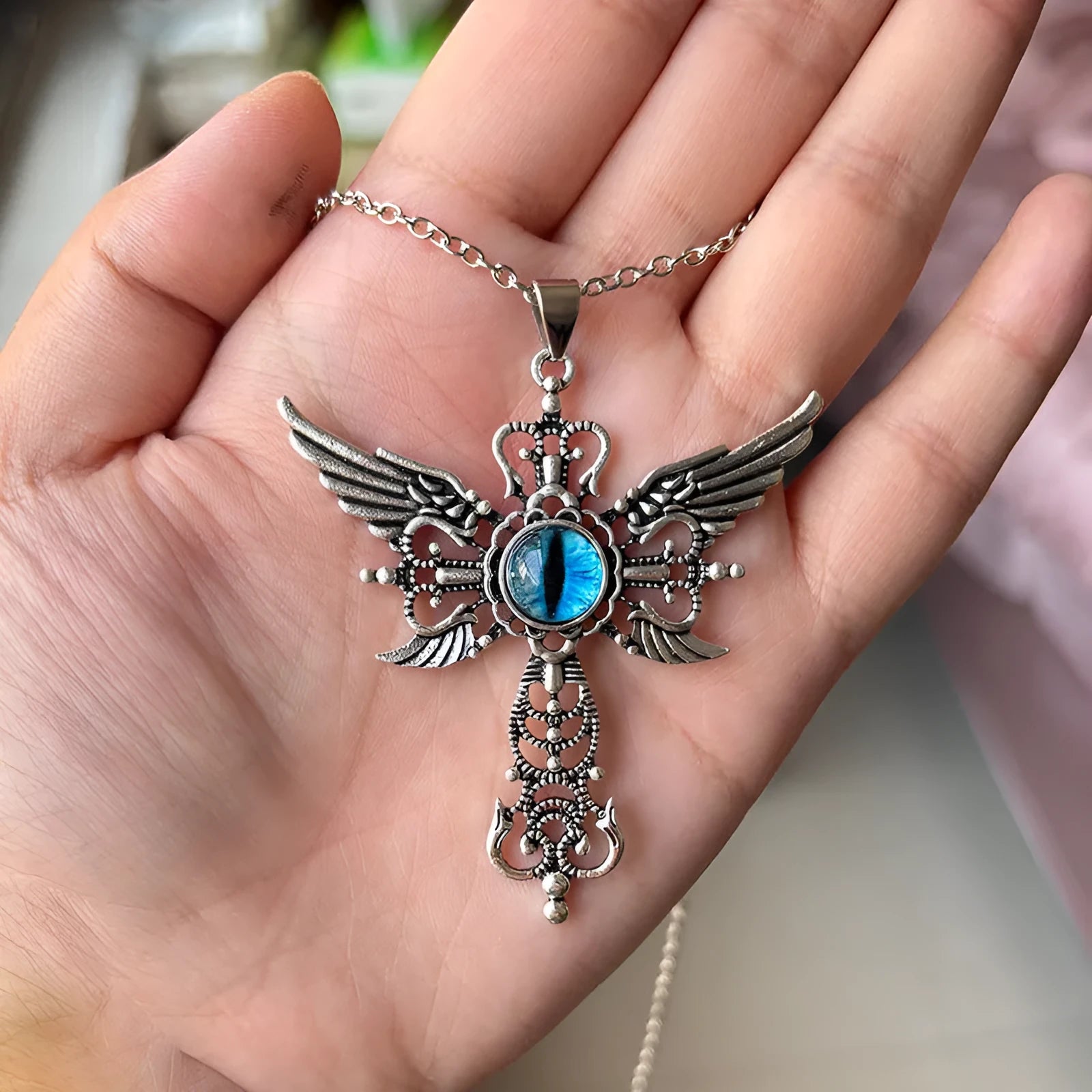 Creative geometric devil wings cross alloy pendant necklace in blue, green, purple, red, and yellow colour options.