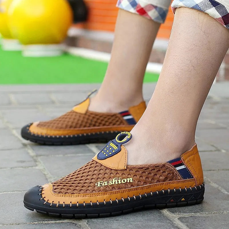 Men's brown casual mesh shoes with a round toe and stitched rubber sole on a plain background.
