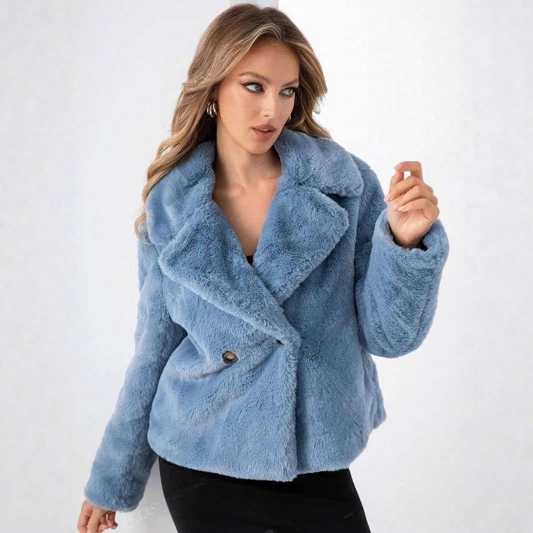 A woman wearing a rose red loose short faux fur coat with regular sleeves.