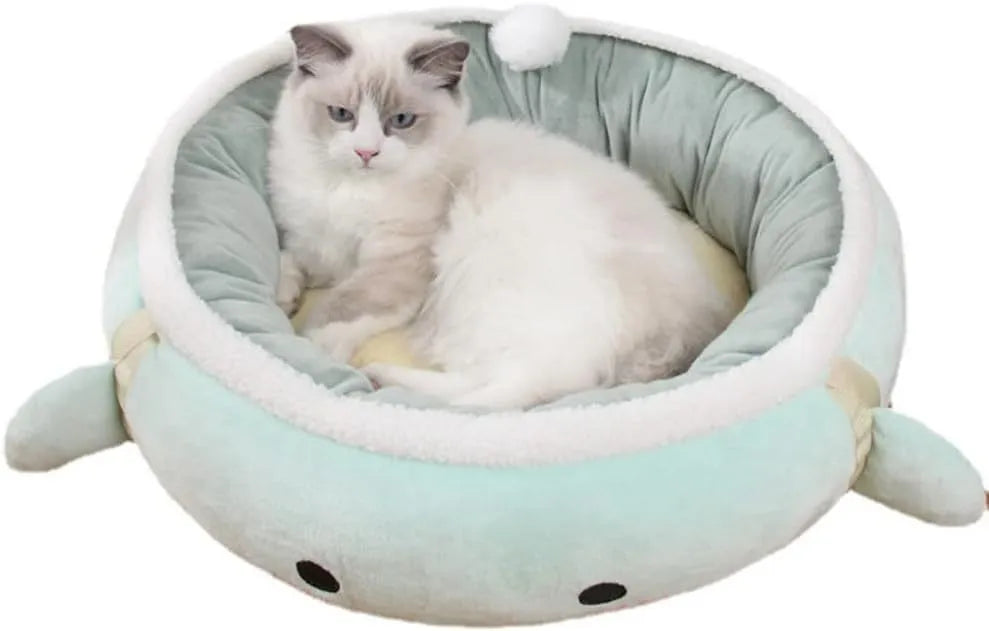 Green dinosaur-shaped cat bed shown both flat as a sofa and hanging as a hammock for small pets.