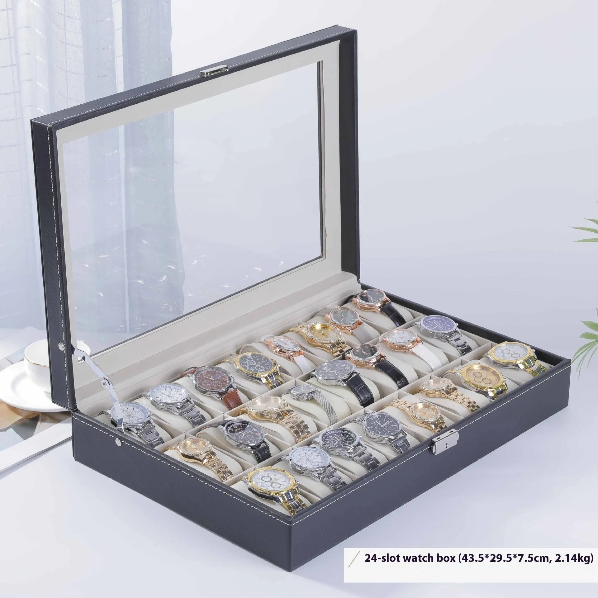 Grey leather watch storage box with transparent lid showing internal watch slots.
