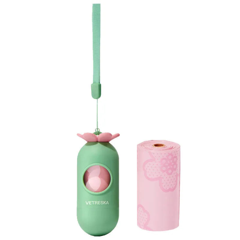 Dog waste disposal capsule with biodegradable bags in strawberry, orange, and cherry blossom colour options