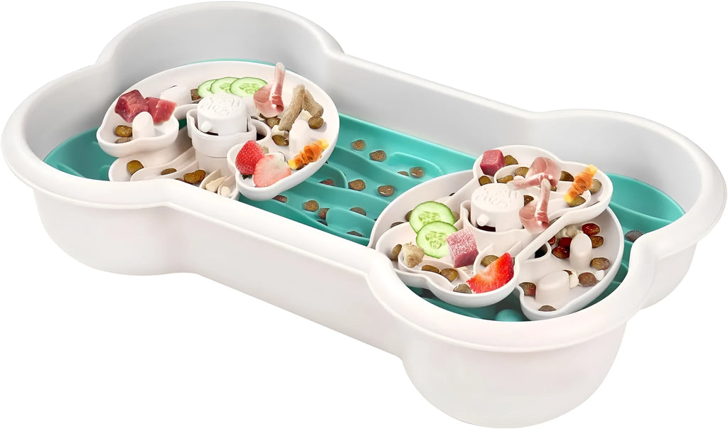 Large green slow feeder dog bowl with wave-pattern trays and suction cups on a wooden floor.