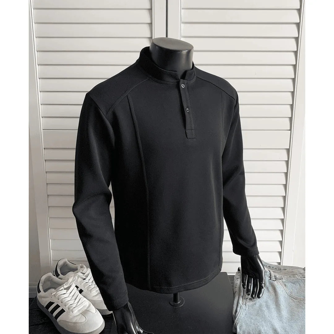 Men's loose fit cotton polo shirt with a stand-up collar and long sleeves in a solid colour.