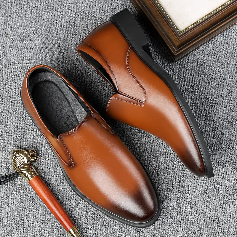 Men's black genuine leather slip-on loafers with a rubber sole and leather toe cap.