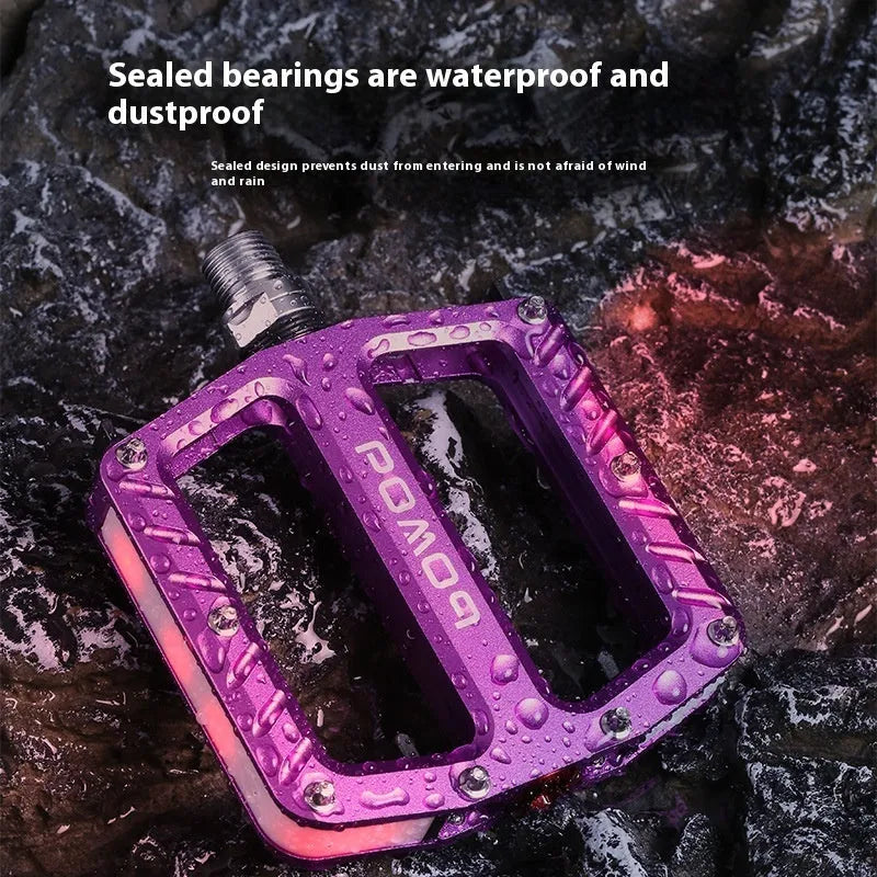 Aluminium alloy bicycle pedals with 710LED lights in black, gold, purple, red, and titanium colour options
