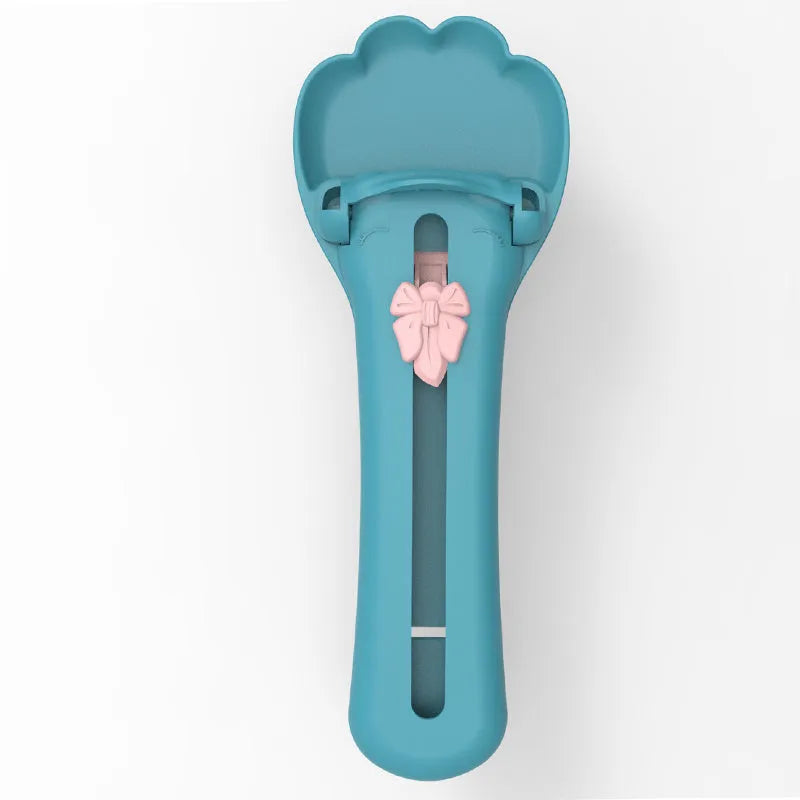 Two-tone pet feed spoon with extrusion scoop and squeezer feeder for liquid food and treats.
