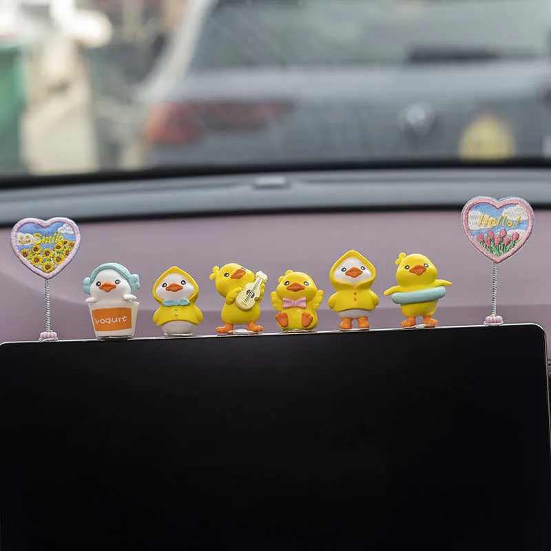 Six yellow PVC duckling ornaments and Hello sign for car dashboard decoration