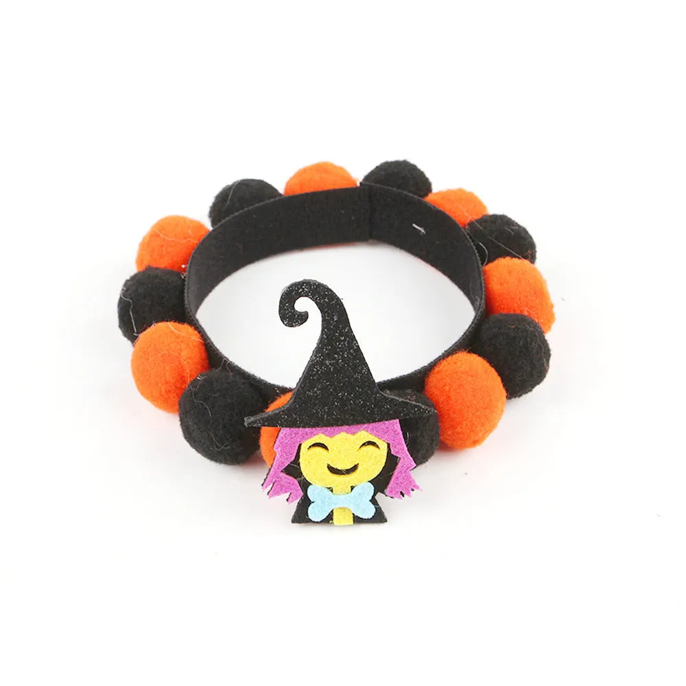 Halloween pet collar with decorative fur ball in pumpkin, bow, skull, and witch designs