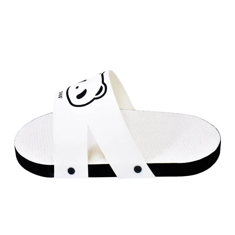White slipper-shaped corrugated paper cat scratch board on a plain background.