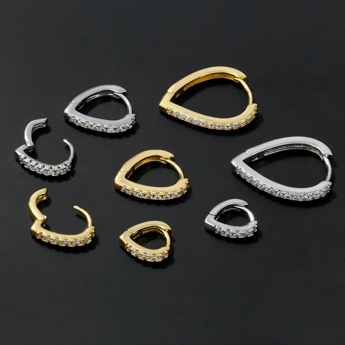 Copper ear clip with geometrical heart design in gold or white electroplated finish