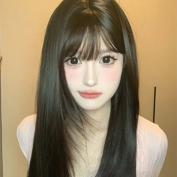 Dark brown full-head wig with long straight hair and bangs on display stand