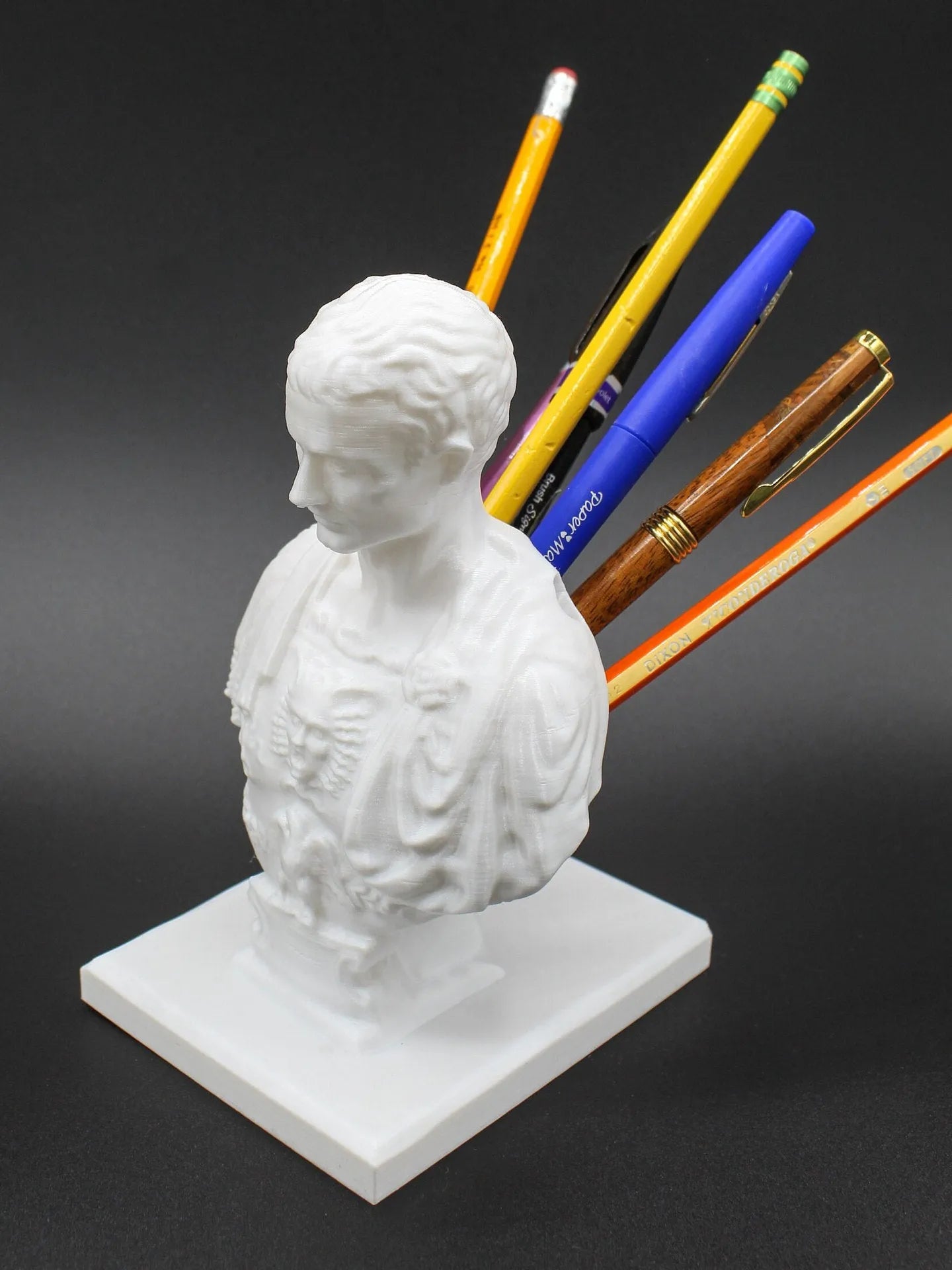 White American creative character pen holder made from synthetic resin for organising writing instruments