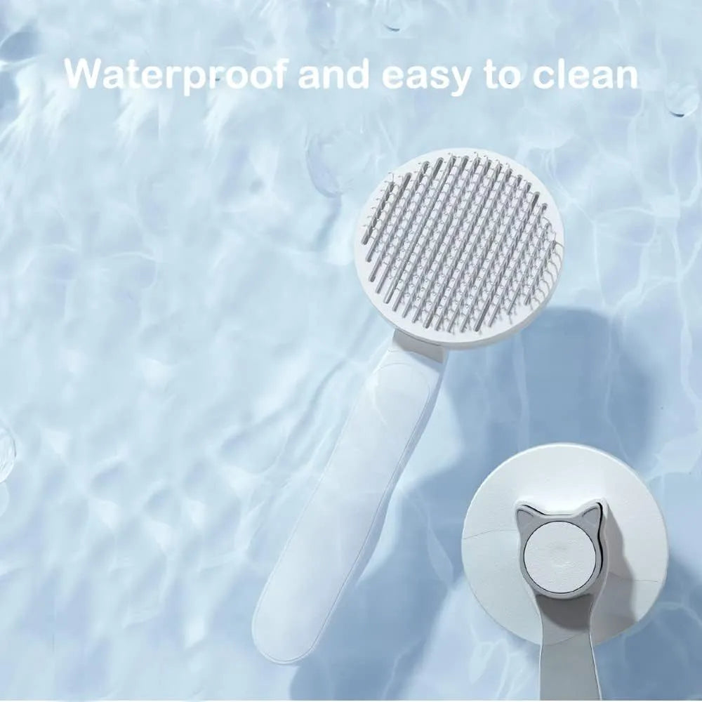 Blue self-cleaning pet brush with rubber handle and metal pins for removing loose cat and dog hair.