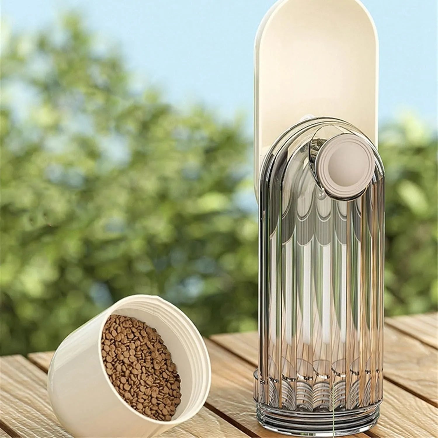 Beige or green folding portable dog water bottle with food dispenser, shown in open and closed positions.