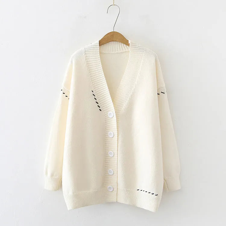 A loose-fitting black women's knitted cardigan top coat with long sleeves.