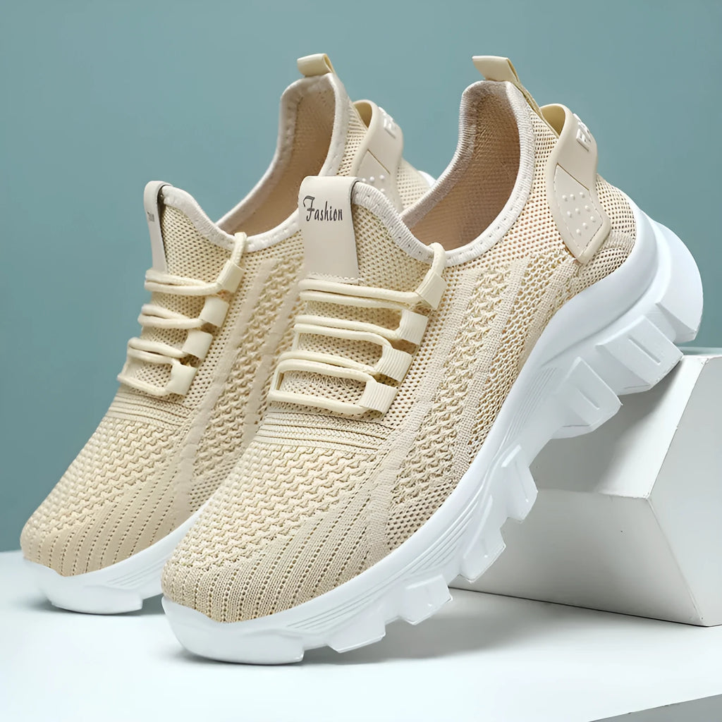 Women's white sneaker with thick PVC sole and breathable flyknit upper