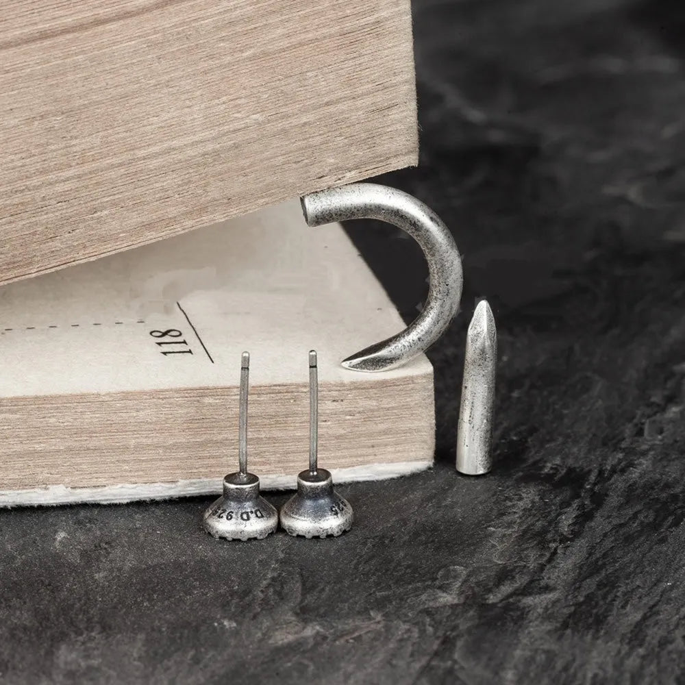 S925 Sterling Silver single nail stud earring on ear hook in straight or curved punk style.