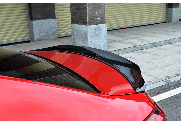 Mazda 3 Exela modified sports tail trim with large fixed wind-surrounded blade in bright black finish