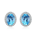 925 sterling silver geometric jewellery set with blue topaz gemstones, showing earrings, ring, pendant, and necklace.