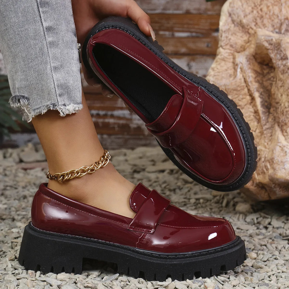 Plus size women's black slip-on loafers with a chunky platform heel and rubber sole