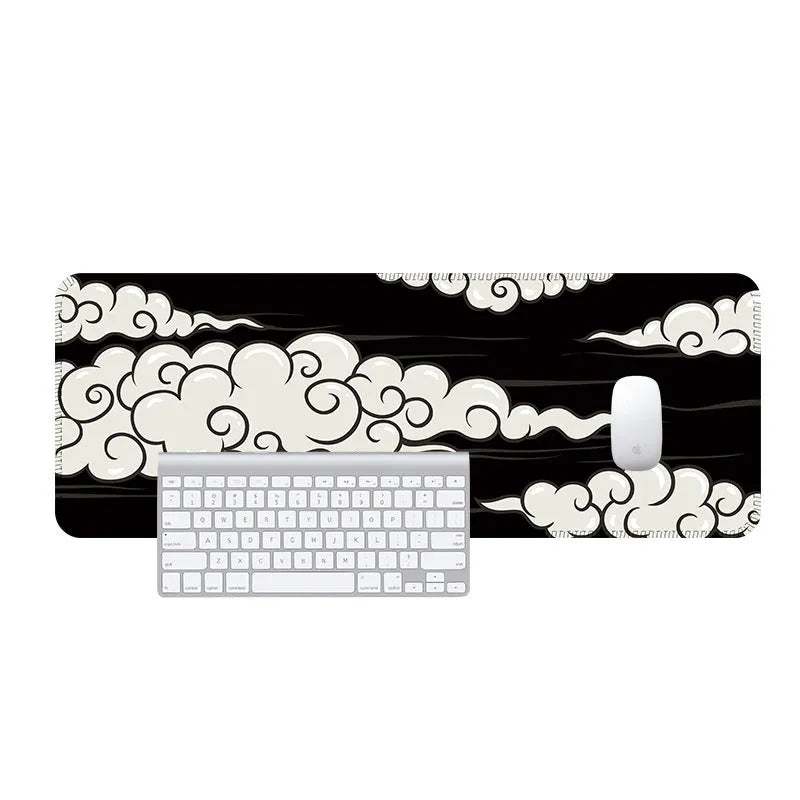 Large rectangular cloud pattern mouse pad and desk mat in natural rubber on a wooden desk.