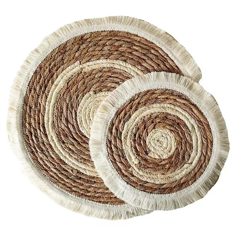 Round papyrus placemat with corn rope tassel edge in solid natural colour, available in multiple sizes.