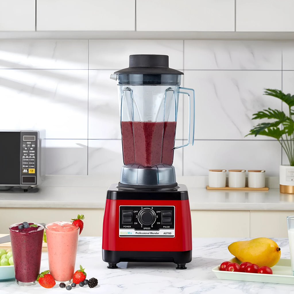 Red commercial blender with stainless steel jug, model A8700, on a countertop.