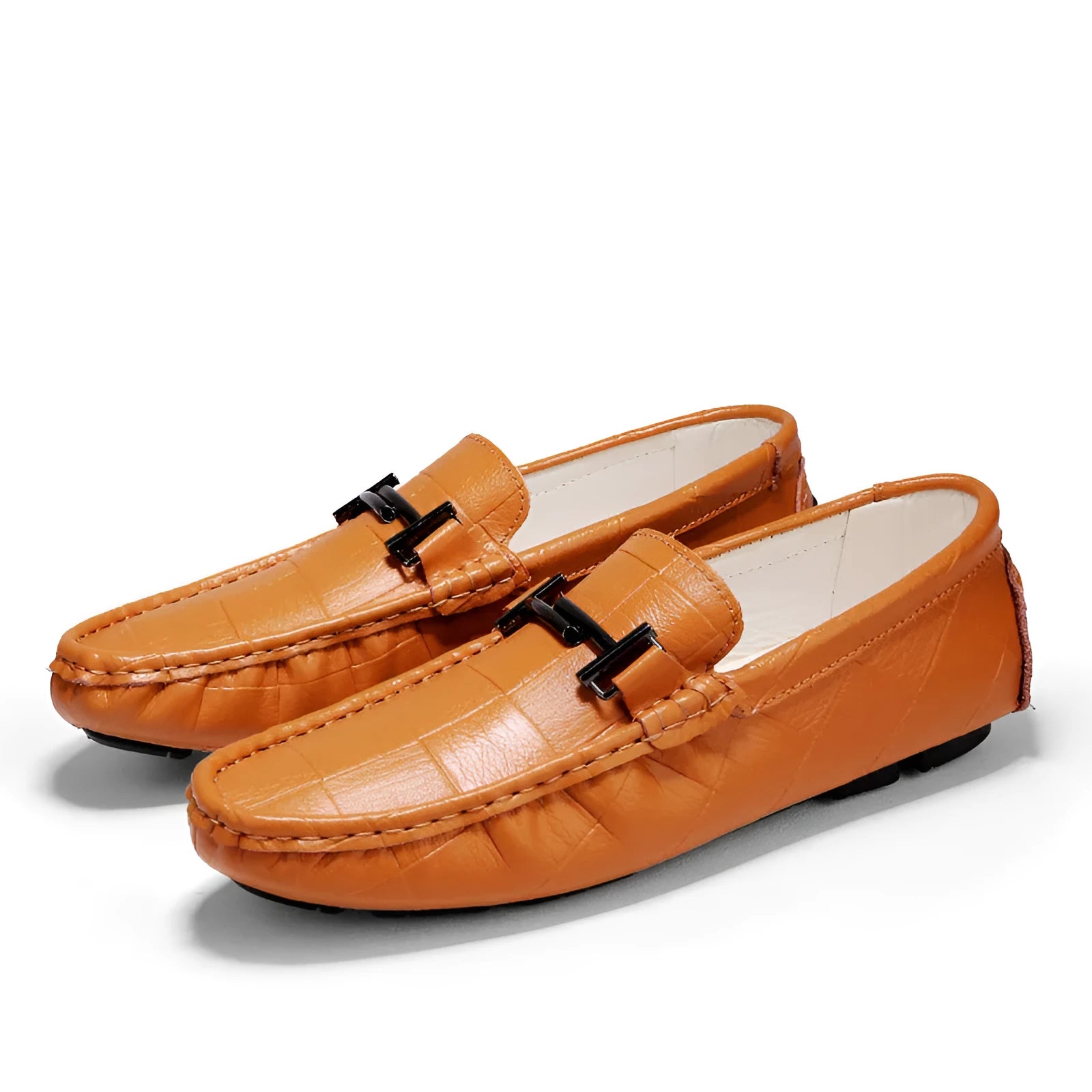 Men's black leather casual shoes with a silver buckle on a flat rubber sole.